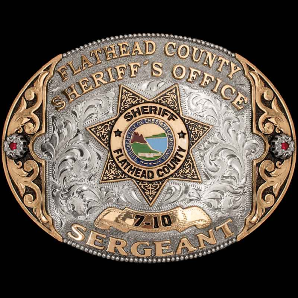 Customize the Bigfork Belt Buckle for any law enforcement organization! This oval-shaped custom buckle is crafted on a hand engraved base with bronze scrollwork. Personalize it today for your organization!